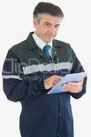 Mature repairman holding digital tablet