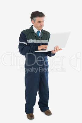 Repairman using laptop Repairman using laptop
