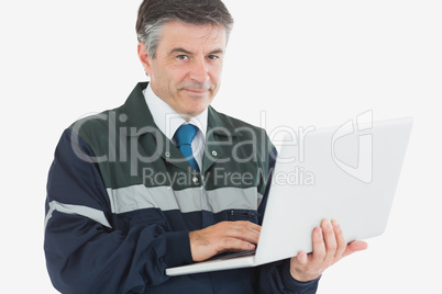 Handsome repairman with laptop Handsome repairman with laptop