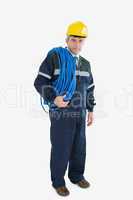 Portrait of mature repairman with large wire and hardhat
