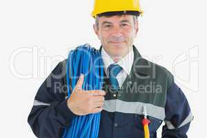 Confident mature man with rolled wire