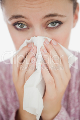 Unhappy young woman suffering from cold