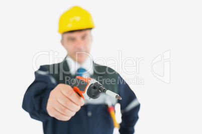Technician holding cordless drill