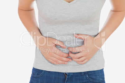 Woman in casuals suffering from stomach ache