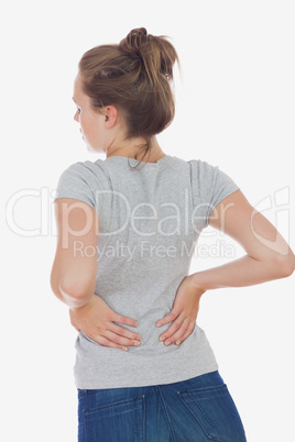 Young woman suffering from back pain