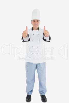 Portrait of mature male chef gesturing thumbs