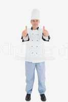 Portrait of mature male chef gesturing thumbs