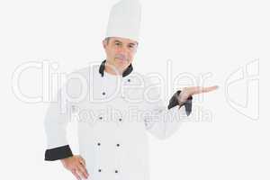 Mature chef displaying invisible product