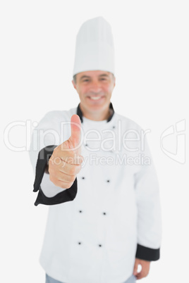 Happy mature chef showing thumbs up