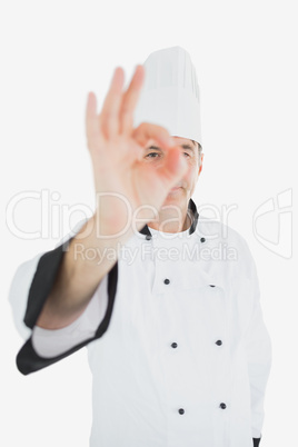 Mature chef gesturing ok sign