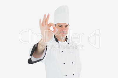 Male chef in uniform showing ok sign