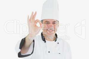 Happy mature chef gesturing ok sign