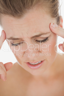 Unhappy woman with severe headache