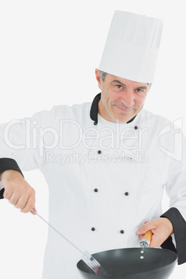 Portrait of male chef cooking food