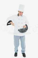 Confident chef cooking food
