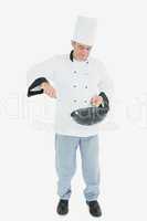 Man in chef uniform cooking food