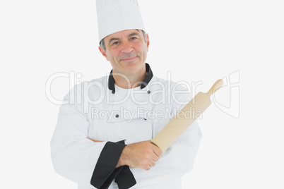 Mature chef holding rolling pin