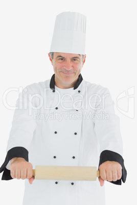 Male chef using rolling pin