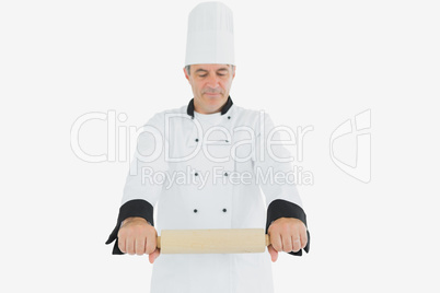 Male chef holding rolling pin