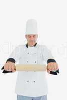 Chef holding out rolling pin