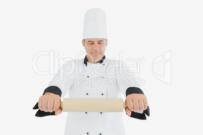 Male chef holding rolling pin