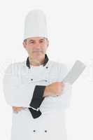 Confident chef holding meat cleaver