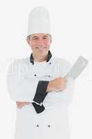 Happy chef holding meat cleaver