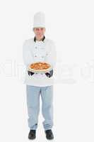 Chef holding pizza