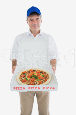 Happy delivery man holding pizza