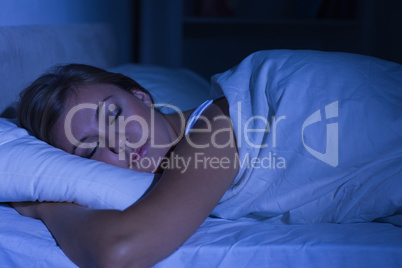Serene woman sleeping at night