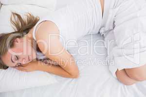 Woman sleeping in the white pyjama