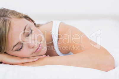 Calm woman napping on the bed