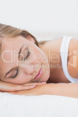 Serene woman napping on the bed