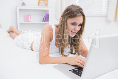Calm woman typing on the laptop Calm woman typing on the laptop