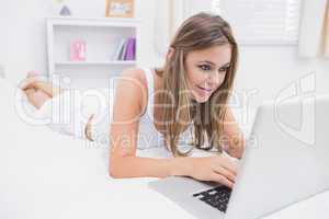 Calm woman typing on the laptop