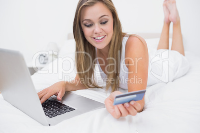 Blonde woman buying on website