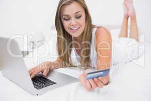 Blonde woman buying on website