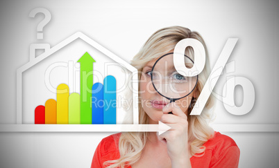 Woman standing behind energy efficient house graphic with questi