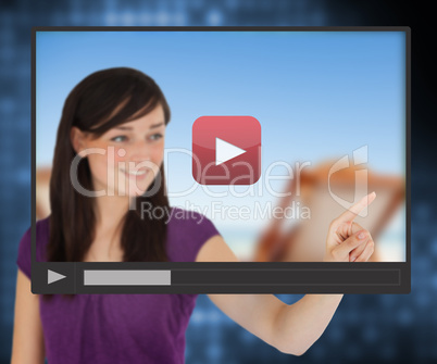 Woman pointing on touch screen with video