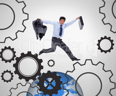 Businessman running against a grey background