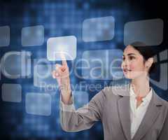 Businesswoman in suit pressing button on touch screen