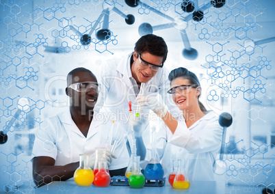 Happy scientist examining test tube on digitally generated backg