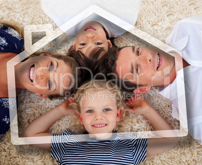 Smiling young family lying with heads together