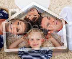 Smiling young family lying with heads together