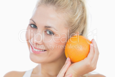 Happy woman with fresh orange