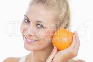 Happy woman with fresh orange