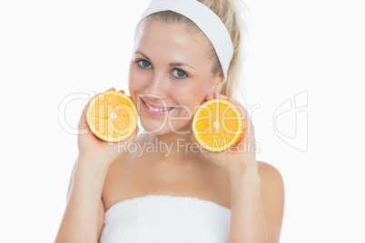 Beautiful woman with sliced orange