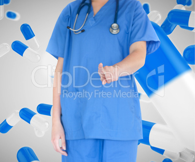 Woman in scrubs working with touch screen