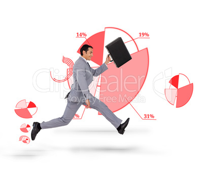 Businessman holding his suitcase and running