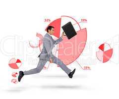 Businessman holding his suitcase and running